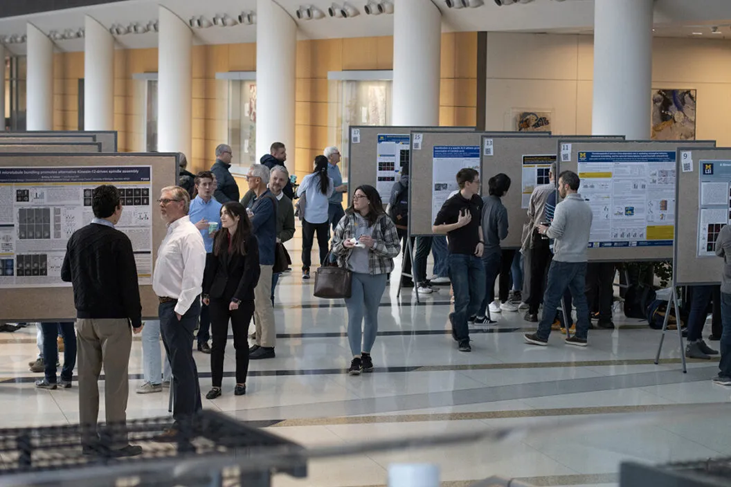 Fellows and attendees at symposium poster session